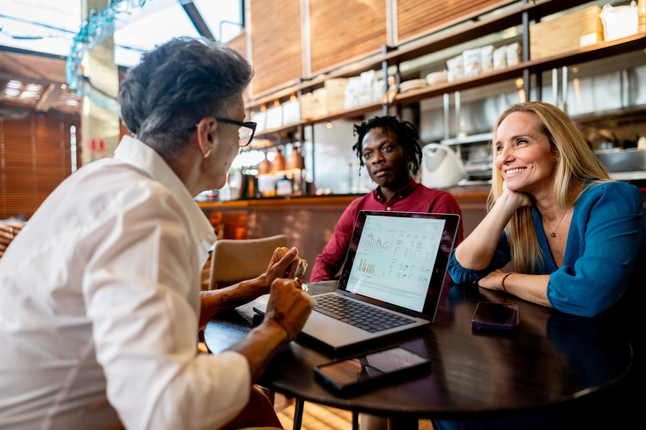 Business consulting discussion with laptop in a meeting setting