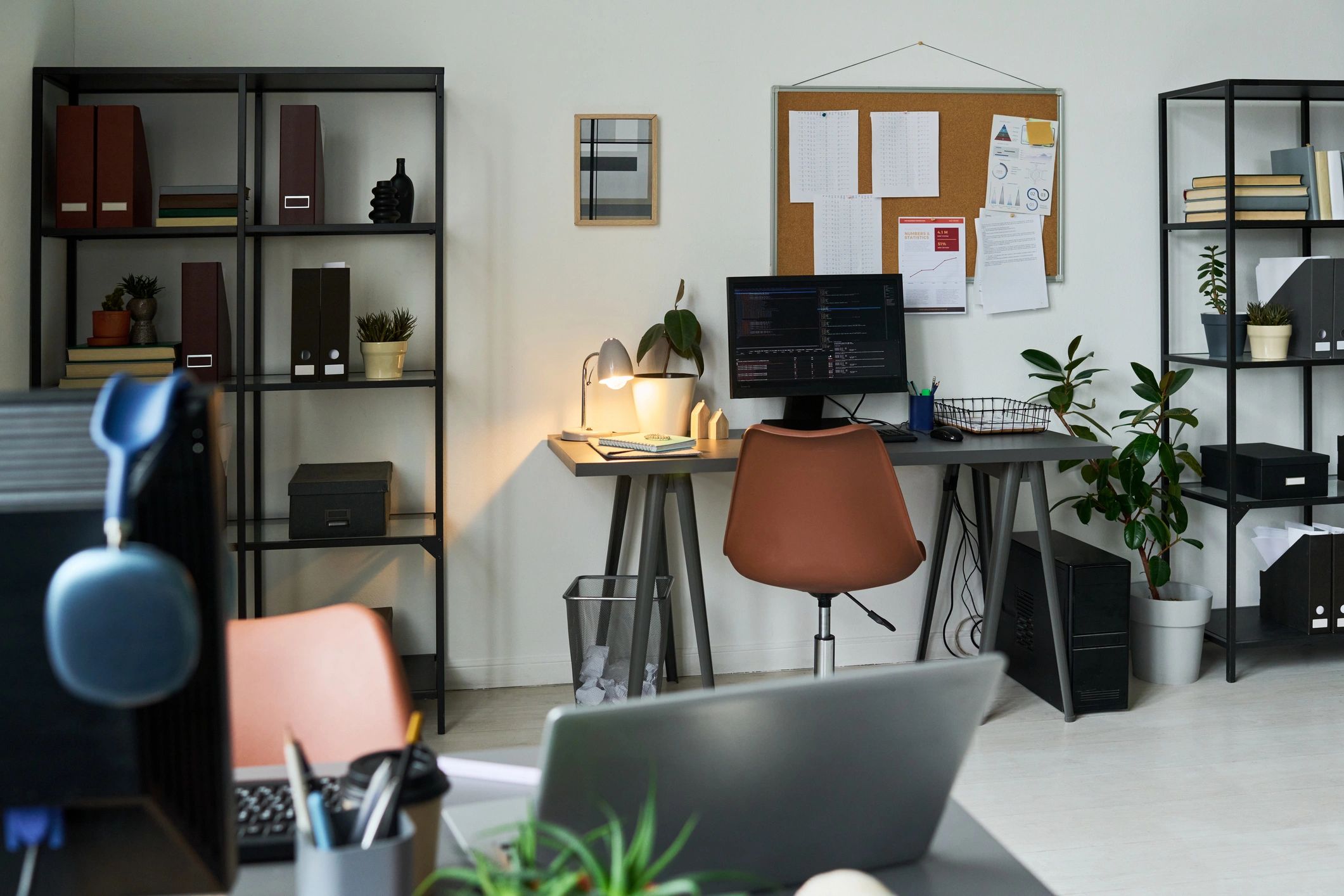 Modern tech workspace with computers and planning tools